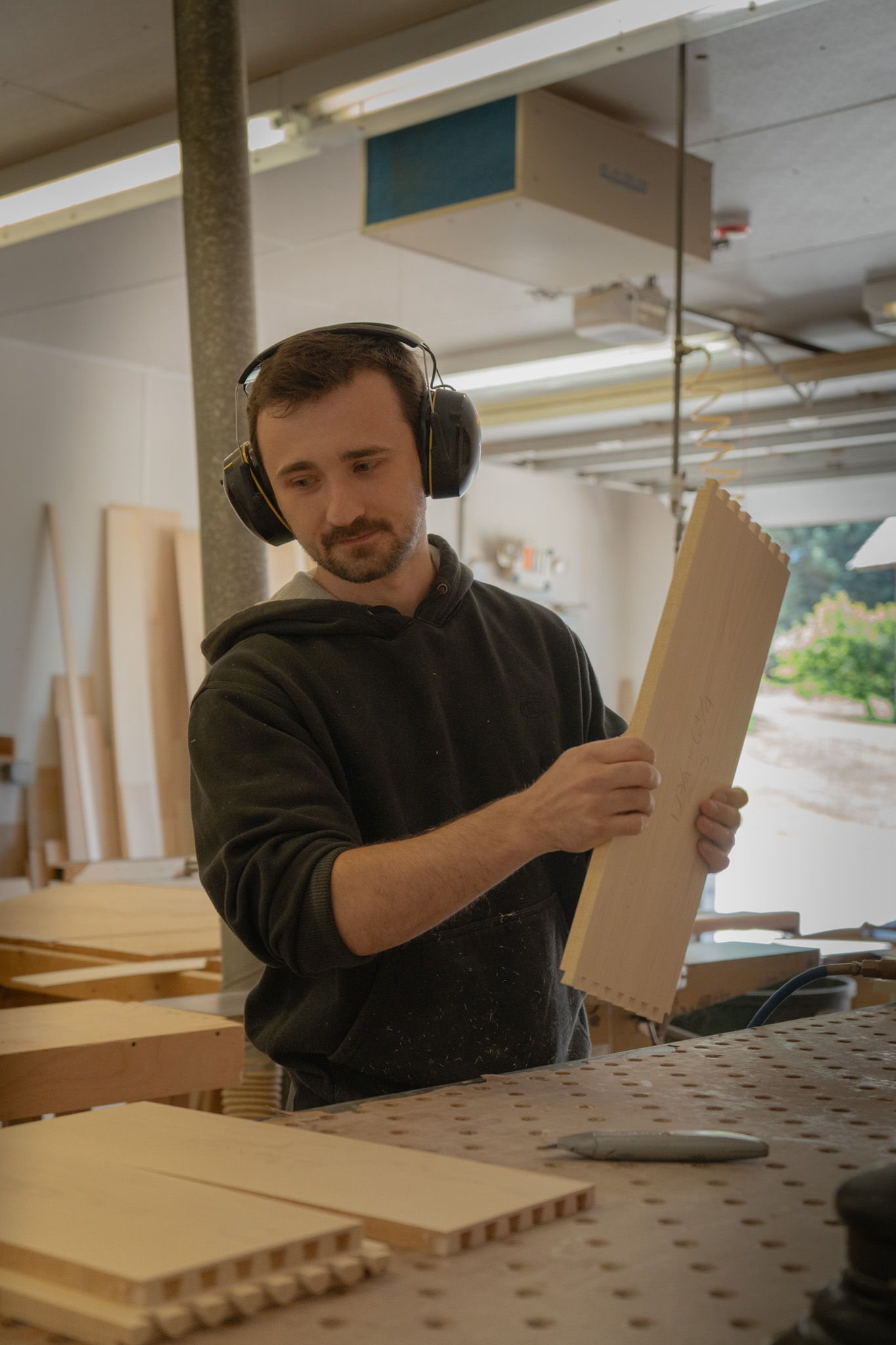 man sanding wood